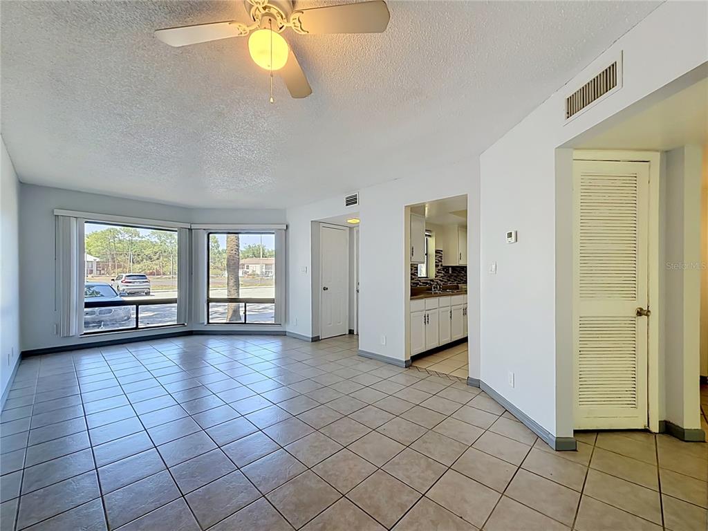2636 Lemon Tree Lane, Unit 2636 Orlando, FL 32839 - Photo 17 of 51 a view of an empty room with window and cabinet