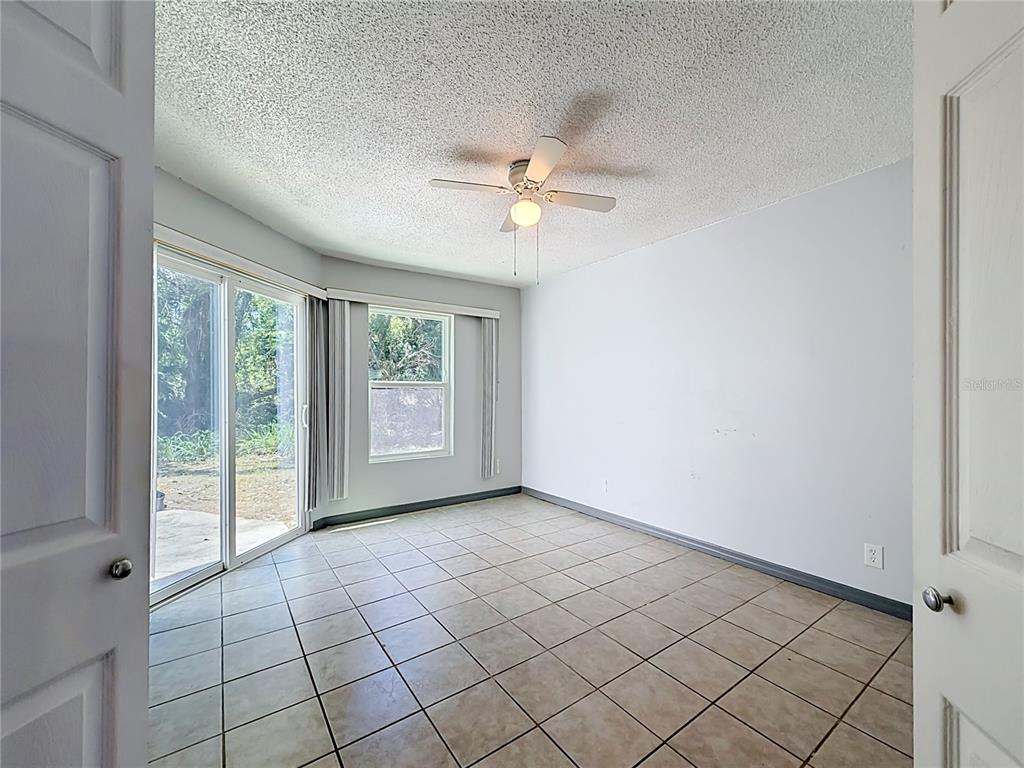 2636 Lemon Tree Lane, Unit 2636 Orlando, FL 32839 - Photo 29 of 51 a view of an empty room with a window