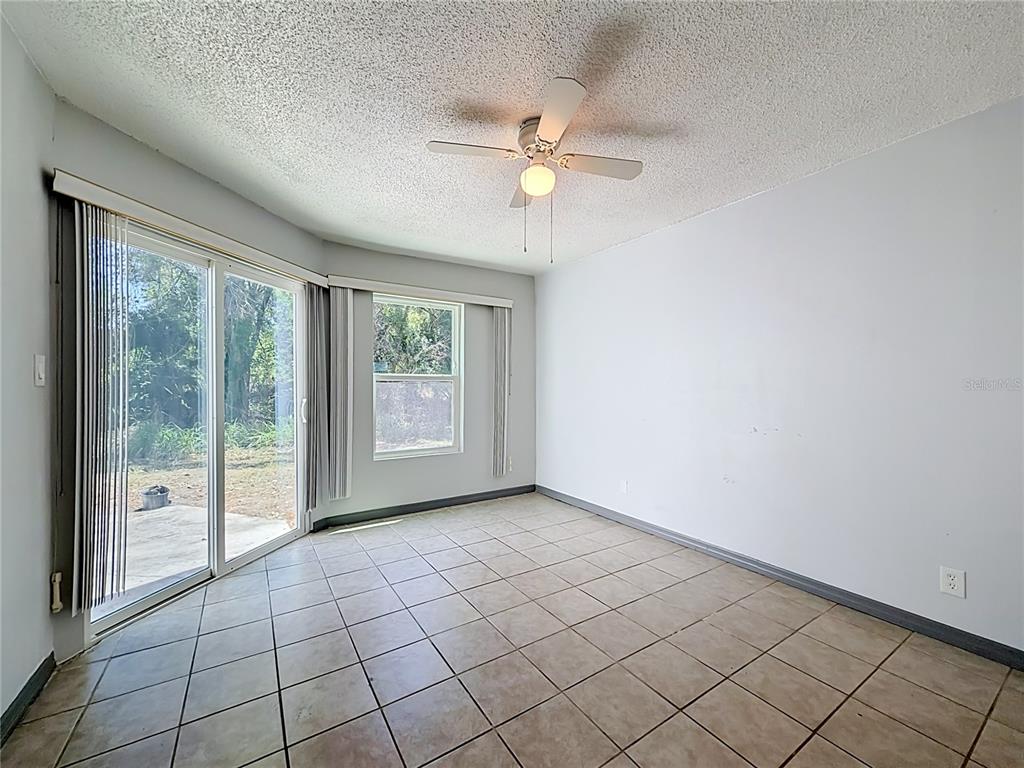 2636 Lemon Tree Lane, Unit 2636 Orlando, FL 32839 - Photo 30 of 51 a view of an empty room with a window