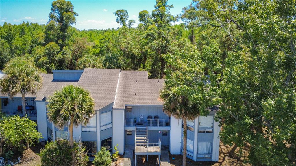 2636 Lemon Tree Lane, Unit 2636 Orlando, FL 32839 - Photo 3 of 51 an aerial view of a house with yard and outdoor seating
