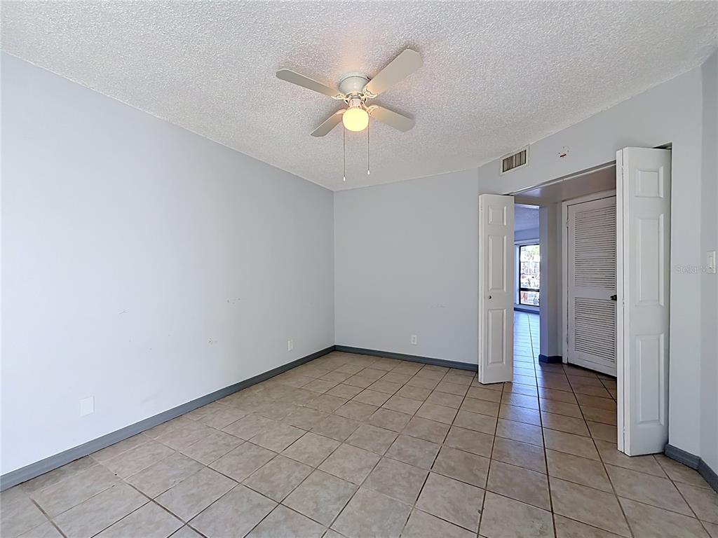2636 Lemon Tree Lane, Unit 2636 Orlando, FL 32839 - Photo 33 of 51 a view of an empty room and window