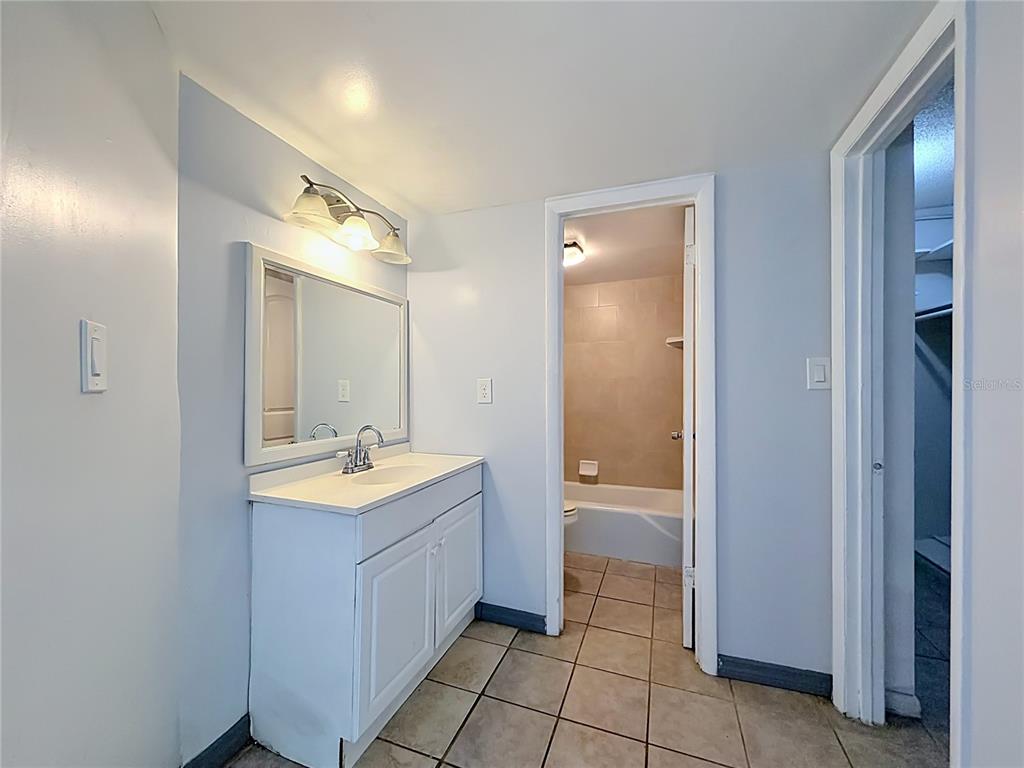 2636 Lemon Tree Lane, Unit 2636 Orlando, FL 32839 - Photo 34 of 51 a bathroom with a sink and a mirror