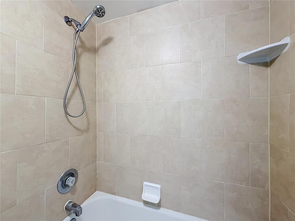 2636 Lemon Tree Lane, Unit 2636 Orlando, FL 32839 - Photo 36 of 51 a bathroom with a shower