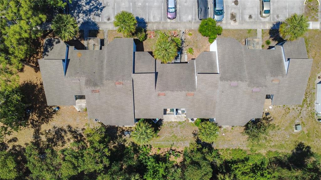2636 Lemon Tree Lane, Unit 2636 Orlando, FL 32839 - Photo 41 of 51 an aerial view of a house with a yard and a garden