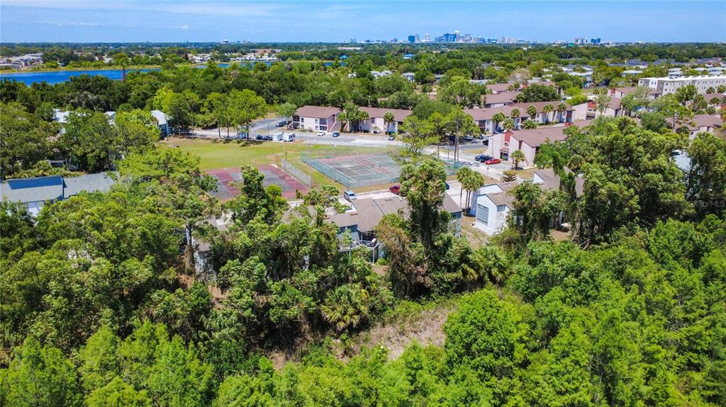 2636 Lemon Tree Lane, Unit 2636 Orlando, FL 32839 - Photo 43 of 51 an aerial view of residential house with outdoor space and trees all around