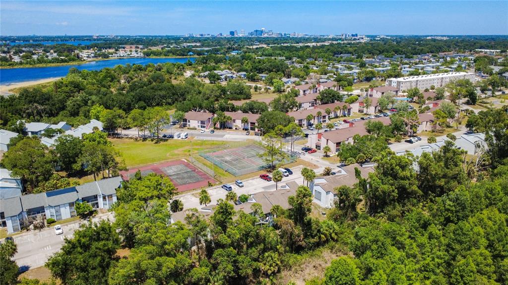 2636 Lemon Tree Lane, Unit 2636 Orlando, FL 32839 - Photo 44 of 51 an aerial view of residential houses with outdoor space and trees