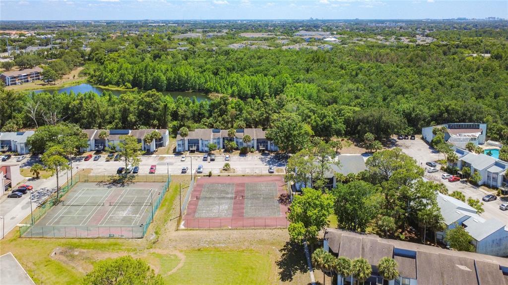 2636 Lemon Tree Lane, Unit 2636 Orlando, FL 32839 - Photo 47 of 51 an aerial view of a swimming pool with a mountain view