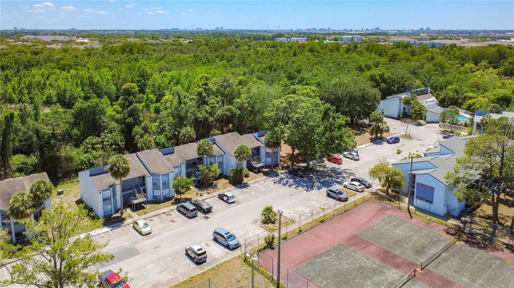 2636 Lemon Tree Lane, Unit 2636 Orlando, FL 32839 - Photo 50 of 51 an aerial view of a house with a yard