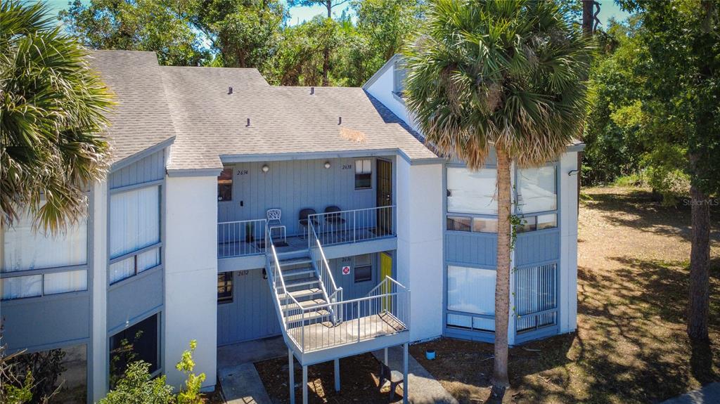 2636 Lemon Tree Lane, Unit 2636 Orlando, FL 32839 - Photo 5 of 51 a view of a house with a balcony
