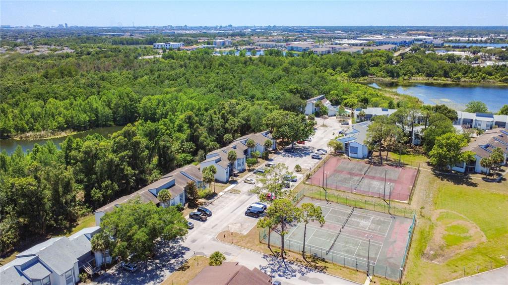 2636 Lemon Tree Lane, Unit 2636 Orlando, FL 32839 - Photo 51 of 51 an aerial view of a city with lots of residential buildings ocean and mountain view in back