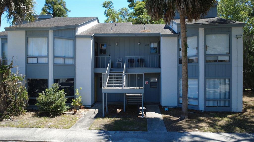 2636 Lemon Tree Lane, Unit 2636 Orlando, FL 32839 - Photo 7 of 51 a view of a house with a yard