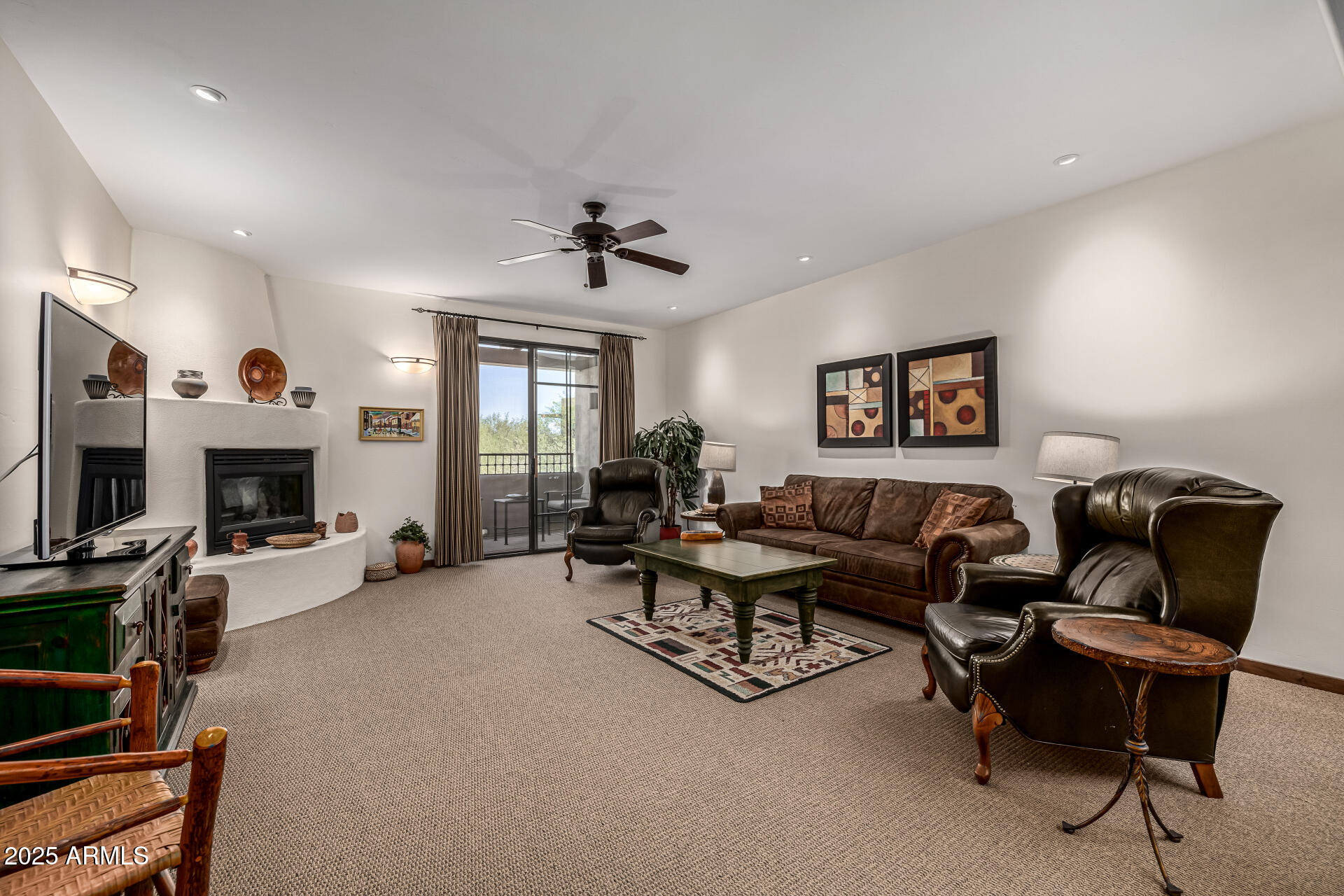 36601 North Mule Train Road, Unit C33 Carefree, AZ 85377 - Photo 12 of 61 a living room with furniture and a fireplace