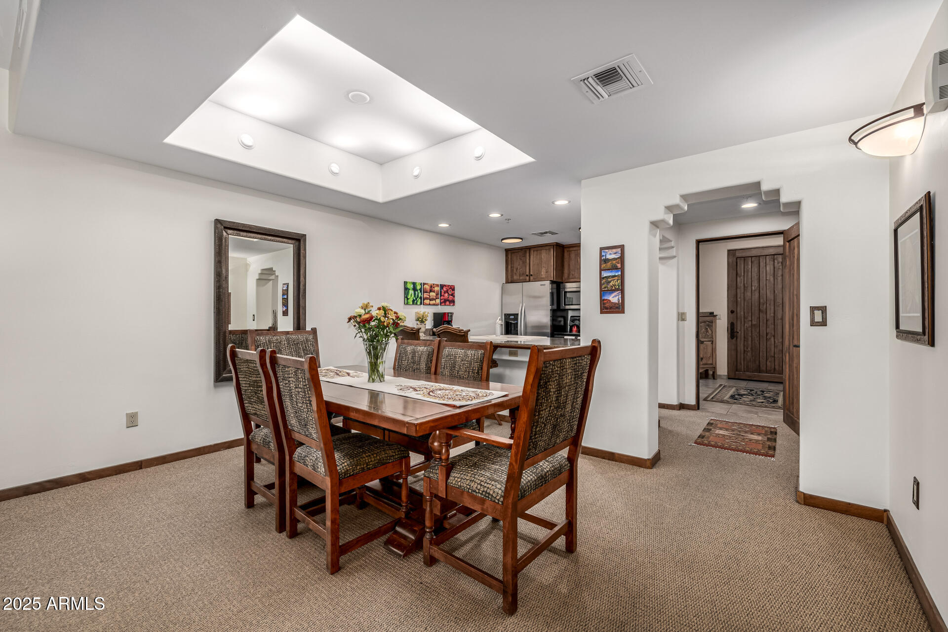 36601 North Mule Train Road, Unit C33 Carefree, AZ 85377 - Photo 17 of 61 a view of a dining room and livingroom with furniture