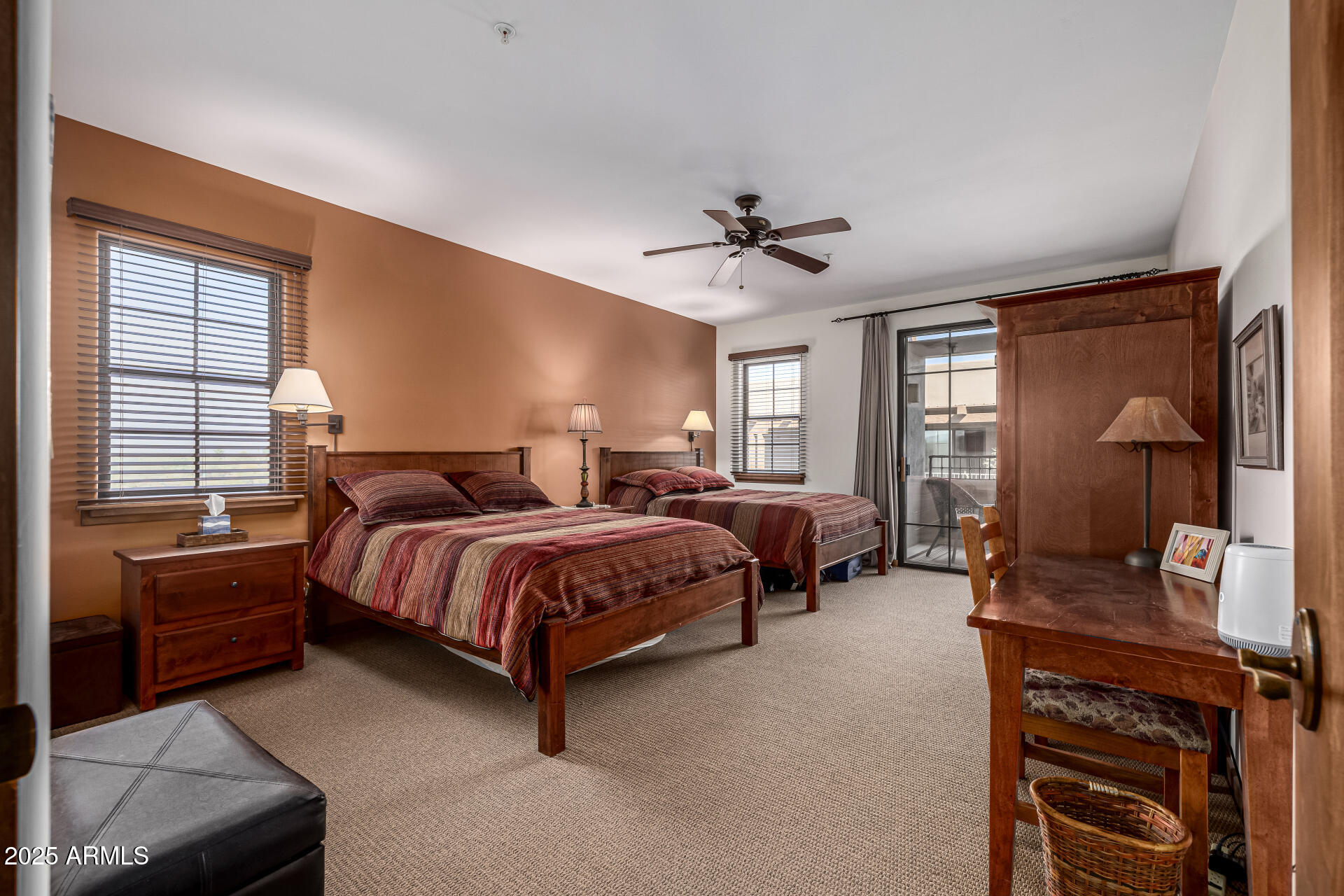 36601 North Mule Train Road, Unit C33 Carefree, AZ 85377 - Photo 19 of 61 a spacious bedroom with a bed a chandelier and a dresser