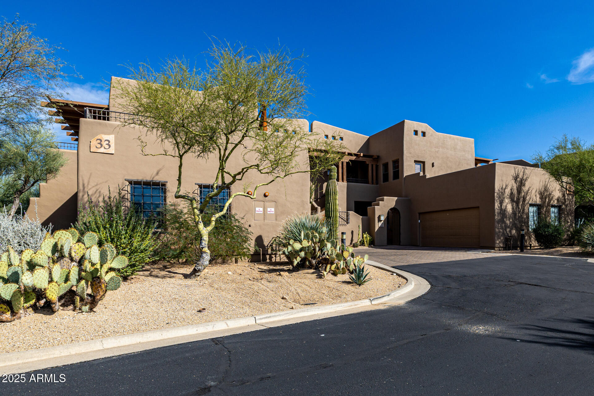 36601 North Mule Train Road, Unit C33 Carefree, AZ 85377 - Photo 2 of 61 a front view of a house with a yard