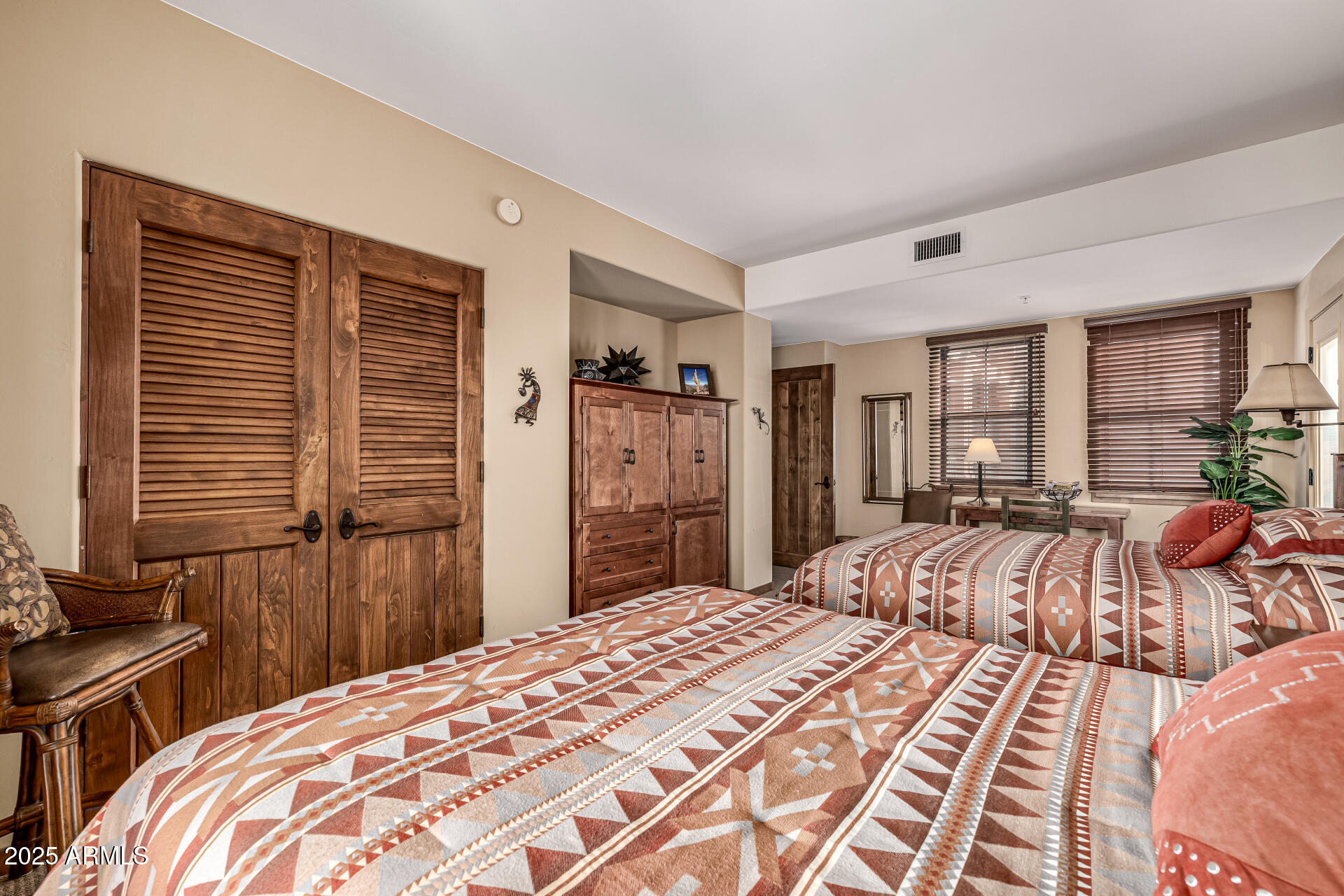 36601 North Mule Train Road, Unit C33 Carefree, AZ 85377 - Photo 24 of 61 a bedroom with a large bed and a window