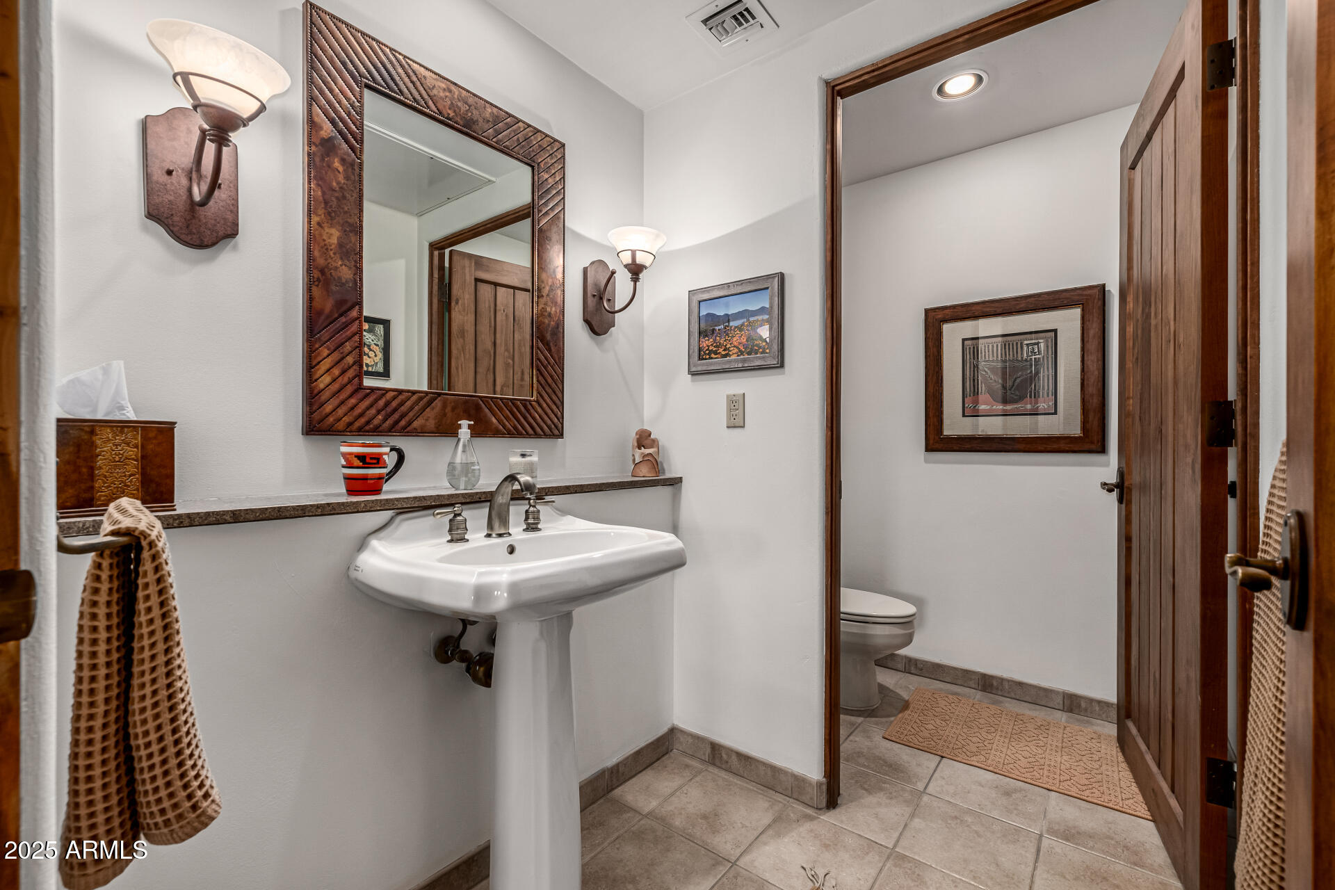36601 North Mule Train Road, Unit C33 Carefree, AZ 85377 - Photo 27 of 61 a bathroom with a sink and a mirror