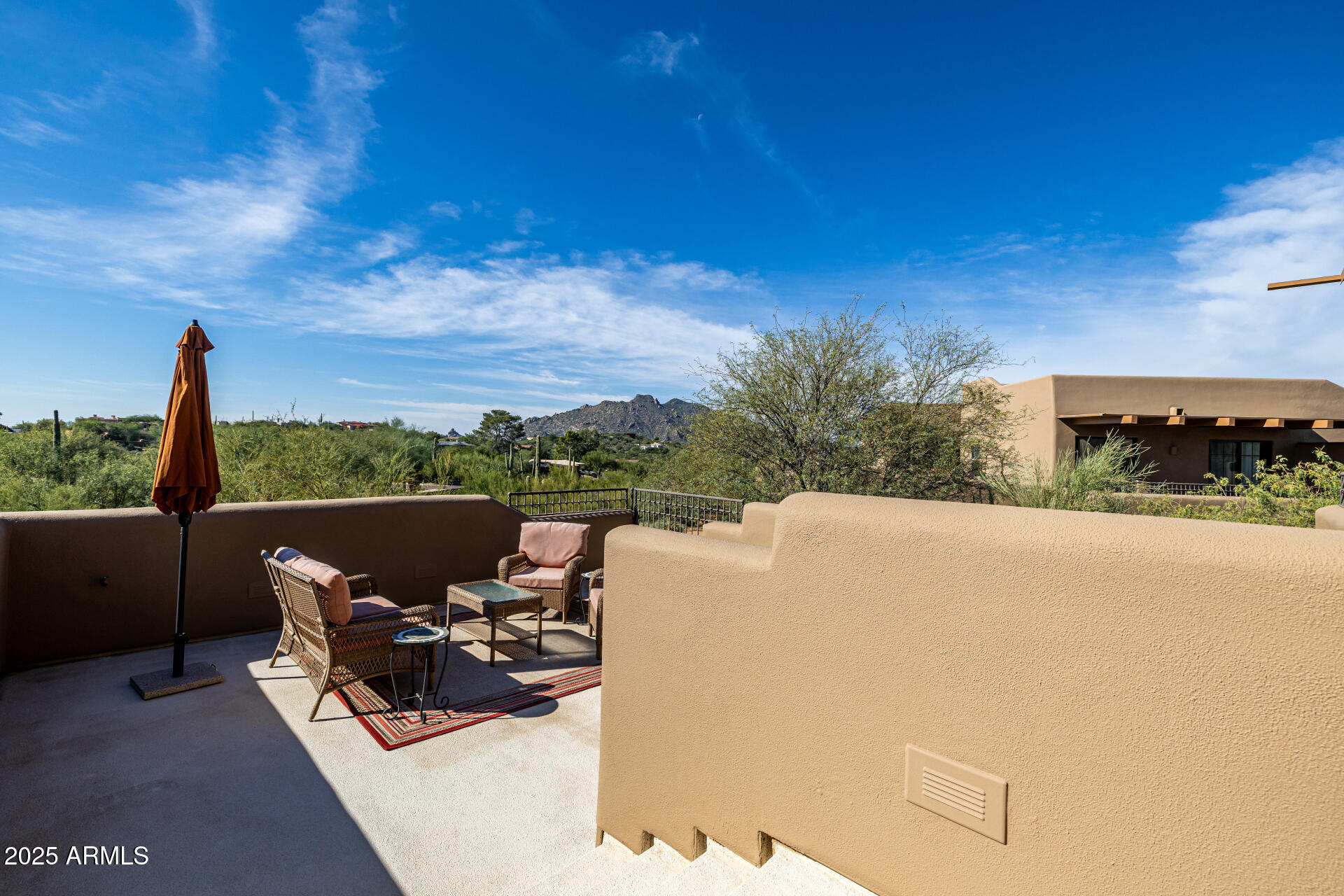 36601 North Mule Train Road, Unit C33 Carefree, AZ 85377 - Photo 33 of 61 a view of a terrace with couches and sky view