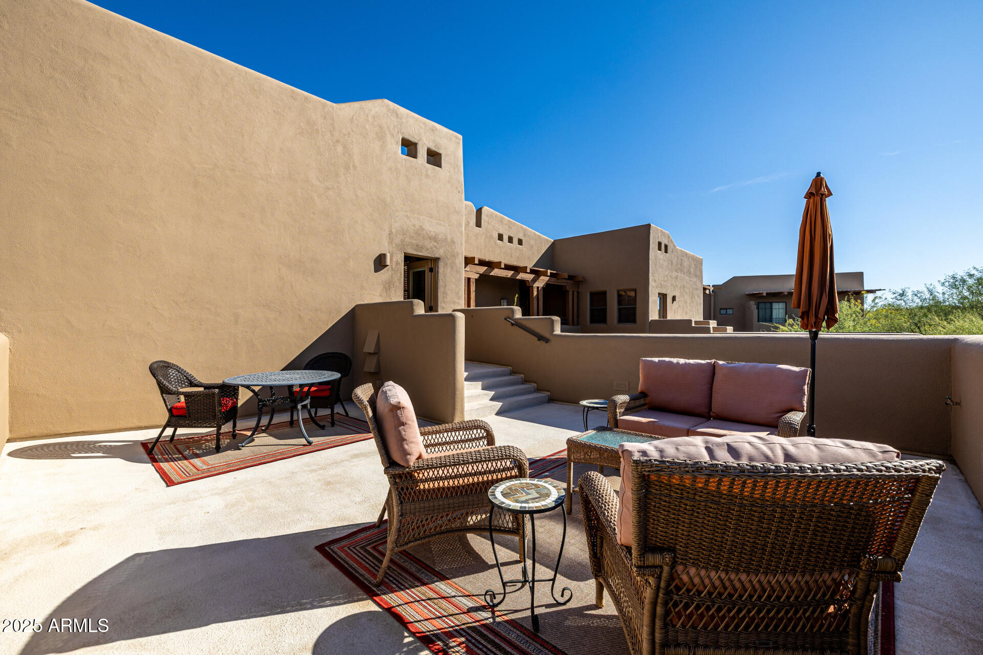 36601 North Mule Train Road, Unit C33 Carefree, AZ 85377 - Photo 34 of 61 a terrace of a house with outdoor seating