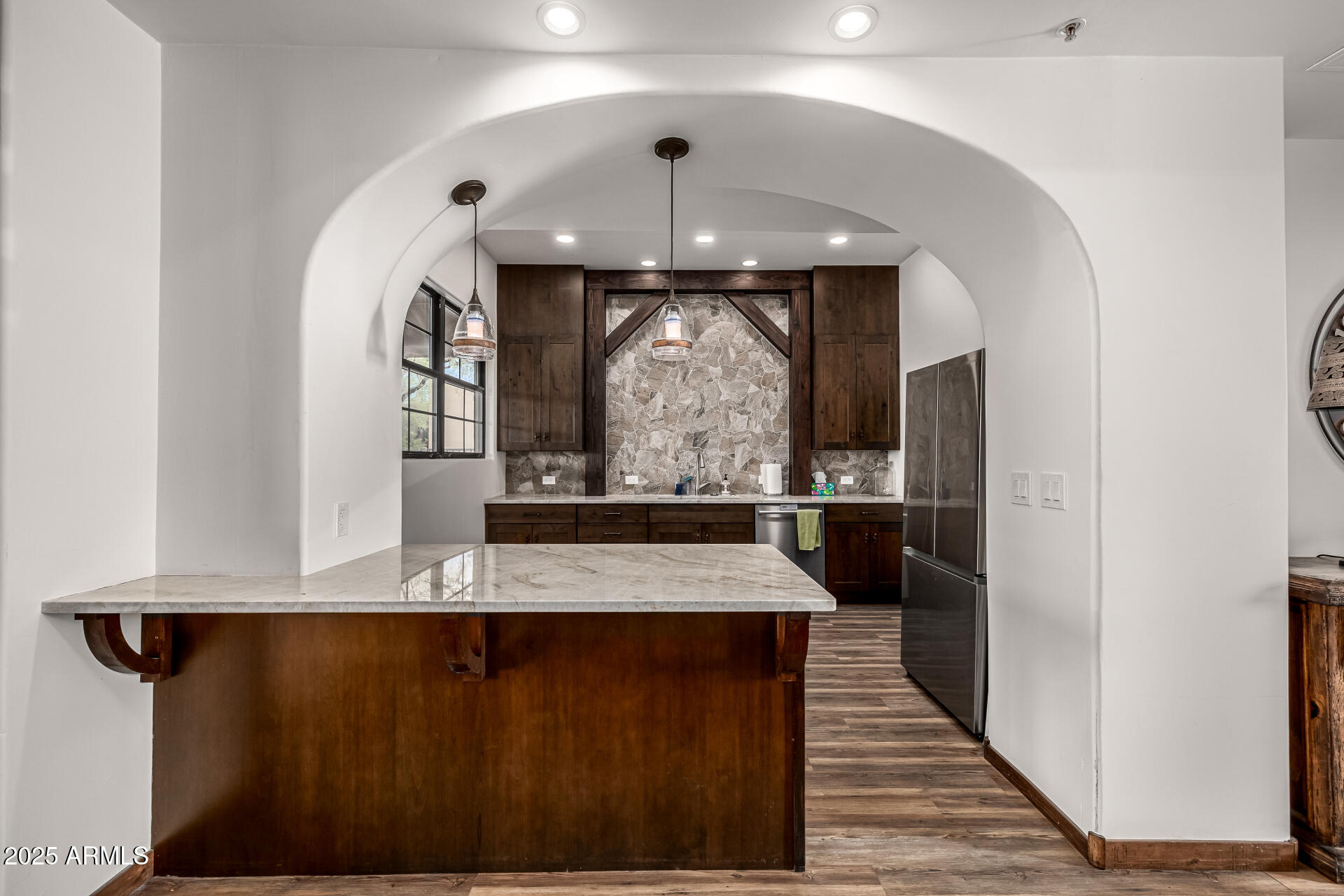 36601 North Mule Train Road, Unit C33 Carefree, AZ 85377 - Photo 39 of 61 a view of a hallway with wooden floor and entryway