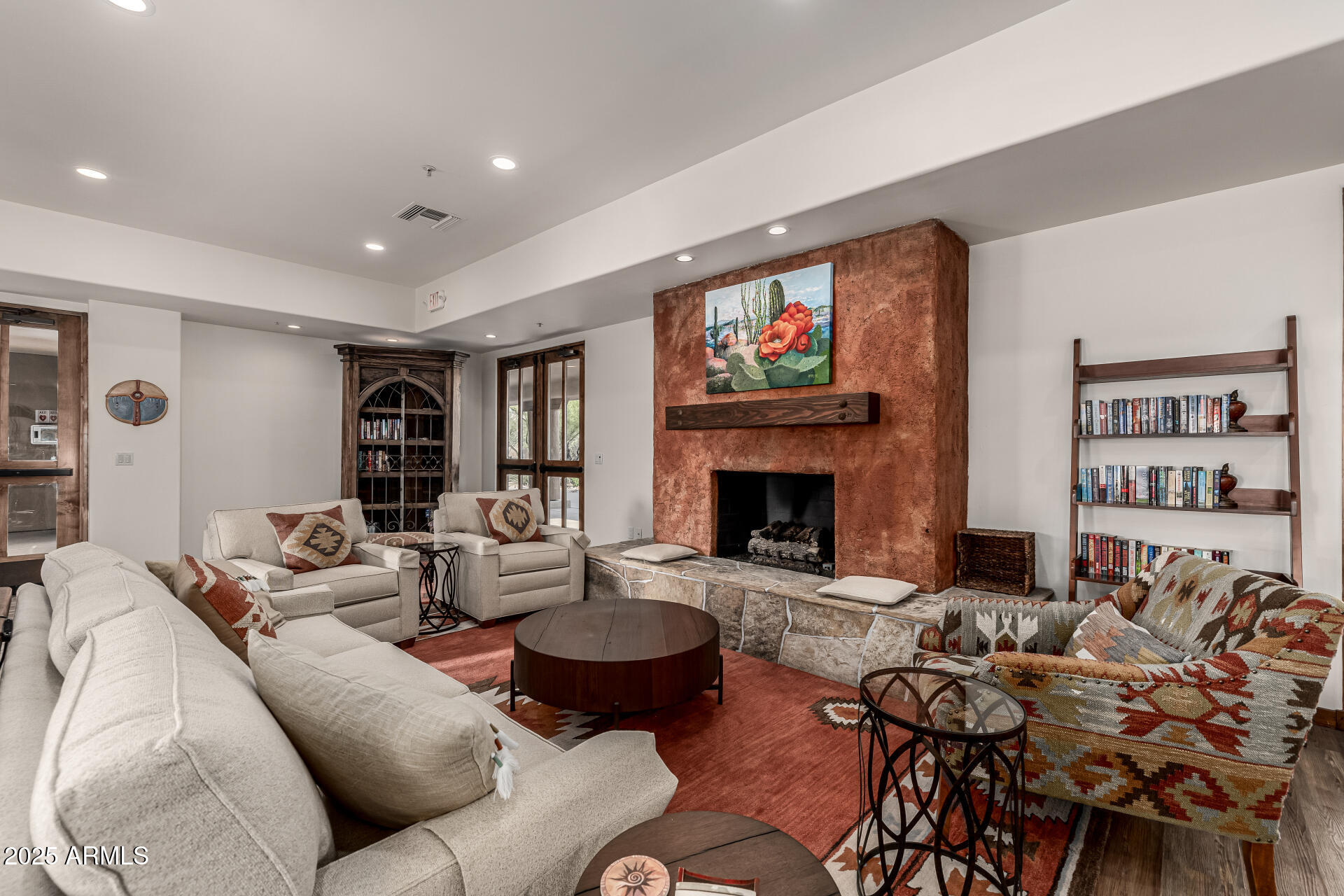 36601 North Mule Train Road, Unit C33 Carefree, AZ 85377 - Photo 40 of 61 a living room with furniture a fireplace and a flat screen tv