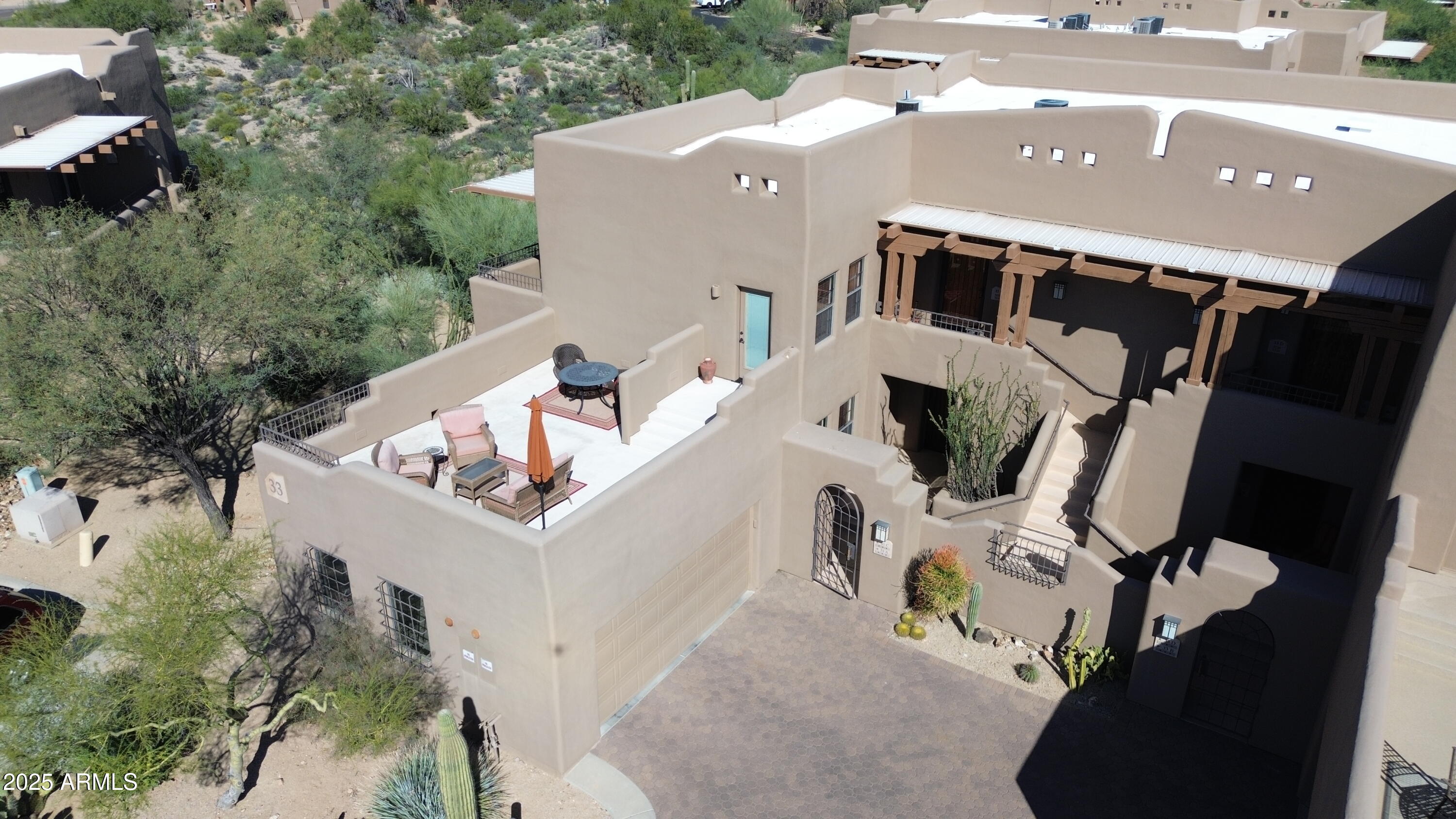 36601 North Mule Train Road, Unit C33 Carefree, AZ 85377 - Photo 45 of 61 an aerial view of a house with swimming pool and sitting area