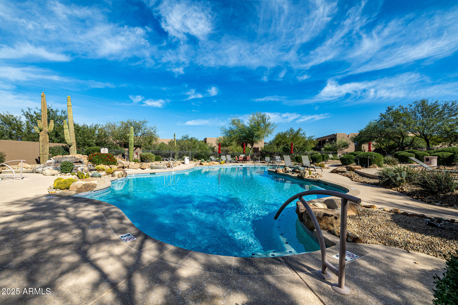 36601 North Mule Train Road, Unit C33 Carefree, AZ 85377 - Photo 50 of 61 a view of a swimming pool with lawn chairs