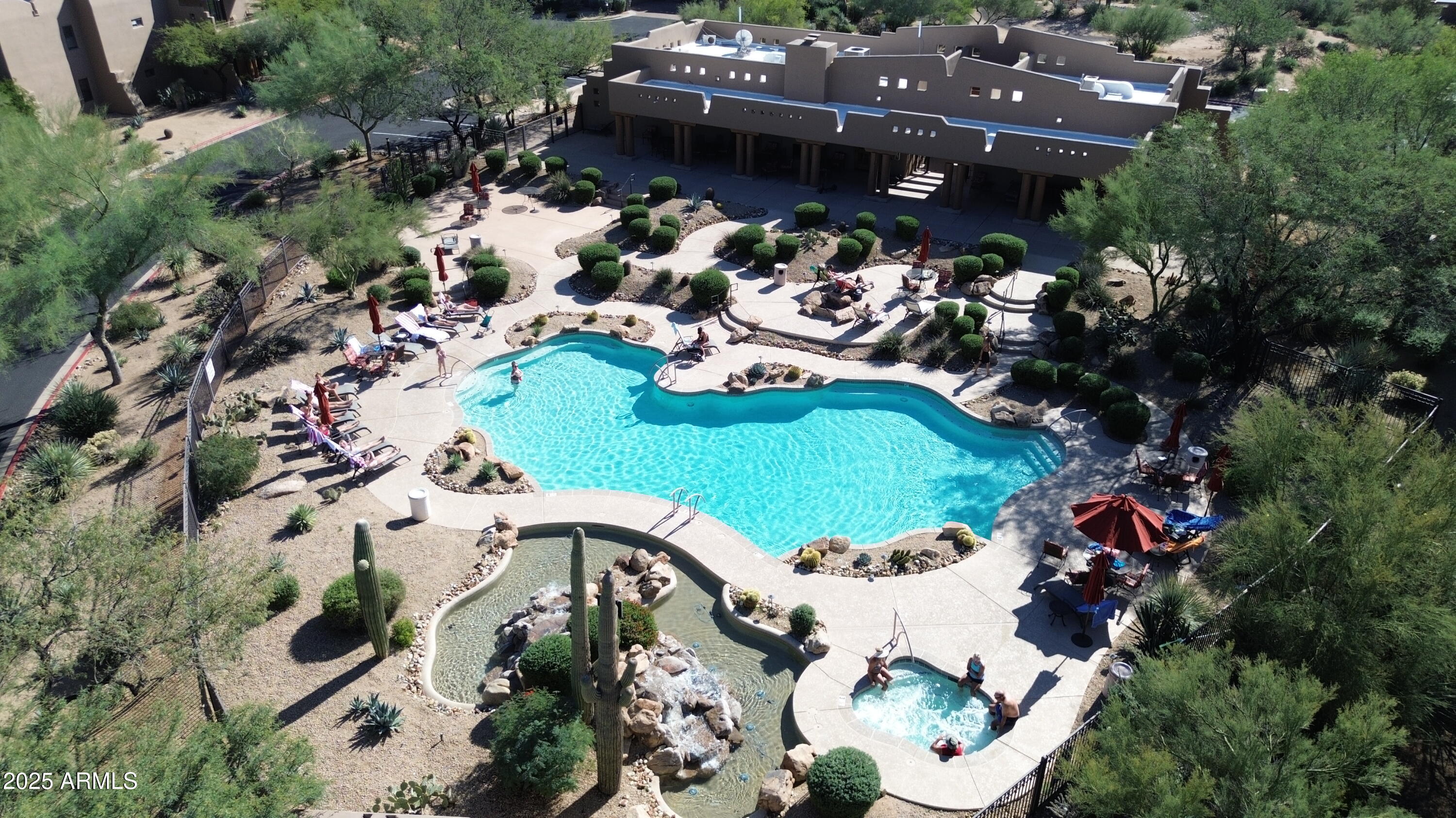 36601 North Mule Train Road, Unit C33 Carefree, AZ 85377 - Photo 54 of 61 an aerial view of a house with a garden and lake view
