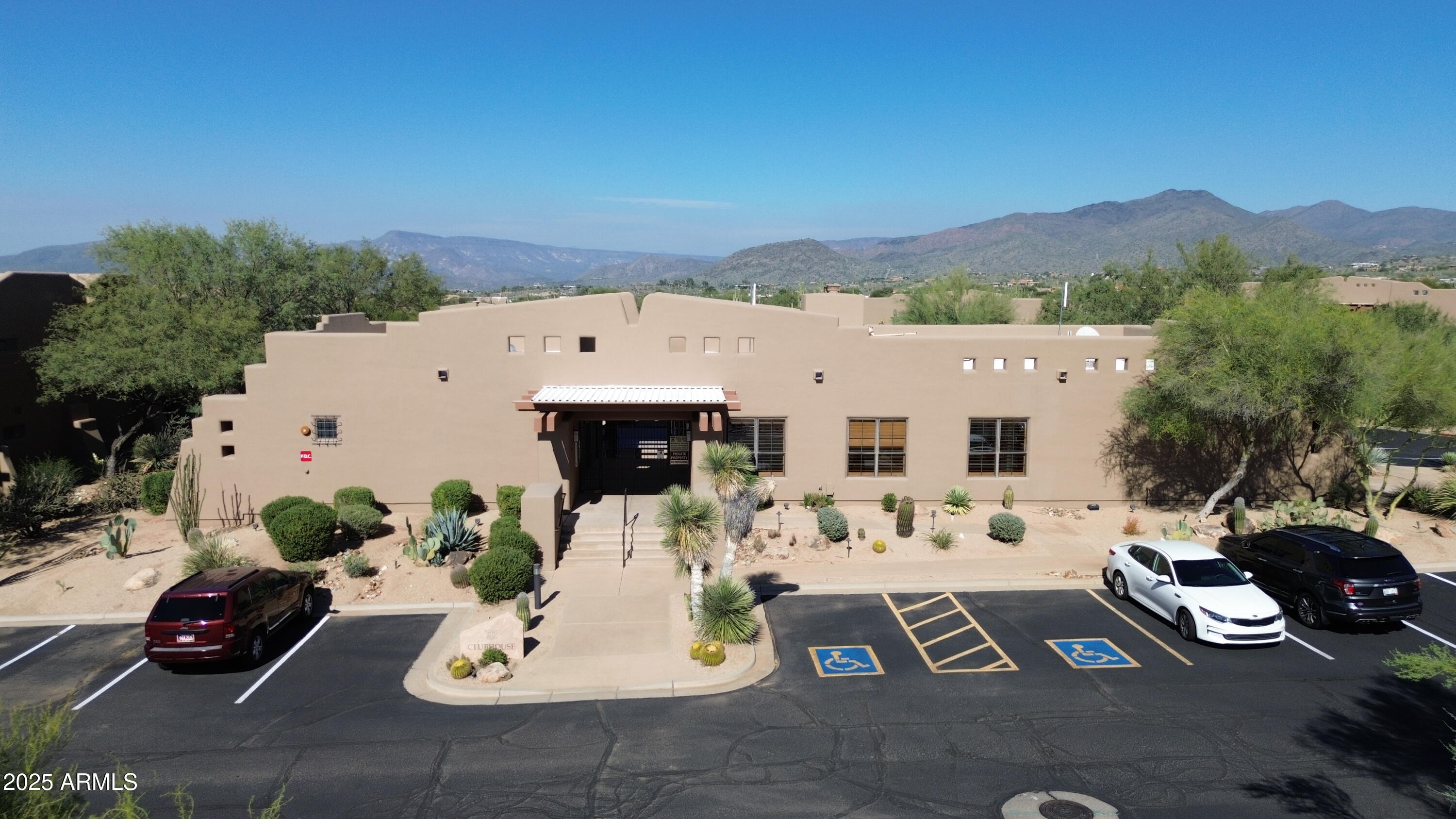 36601 North Mule Train Road, Unit C33 Carefree, AZ 85377 - Photo 57 of 61 a view of a patio with couches table and chairs with potted plants
