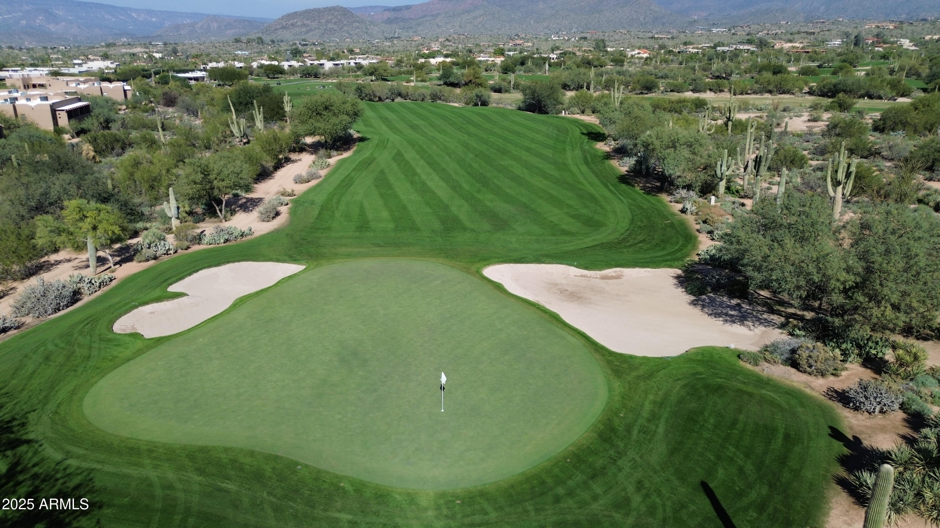 36601 North Mule Train Road, Unit C33 Carefree, AZ 85377 - Photo 58 of 61 an aerial view of green landscape with trees houses and mountain view