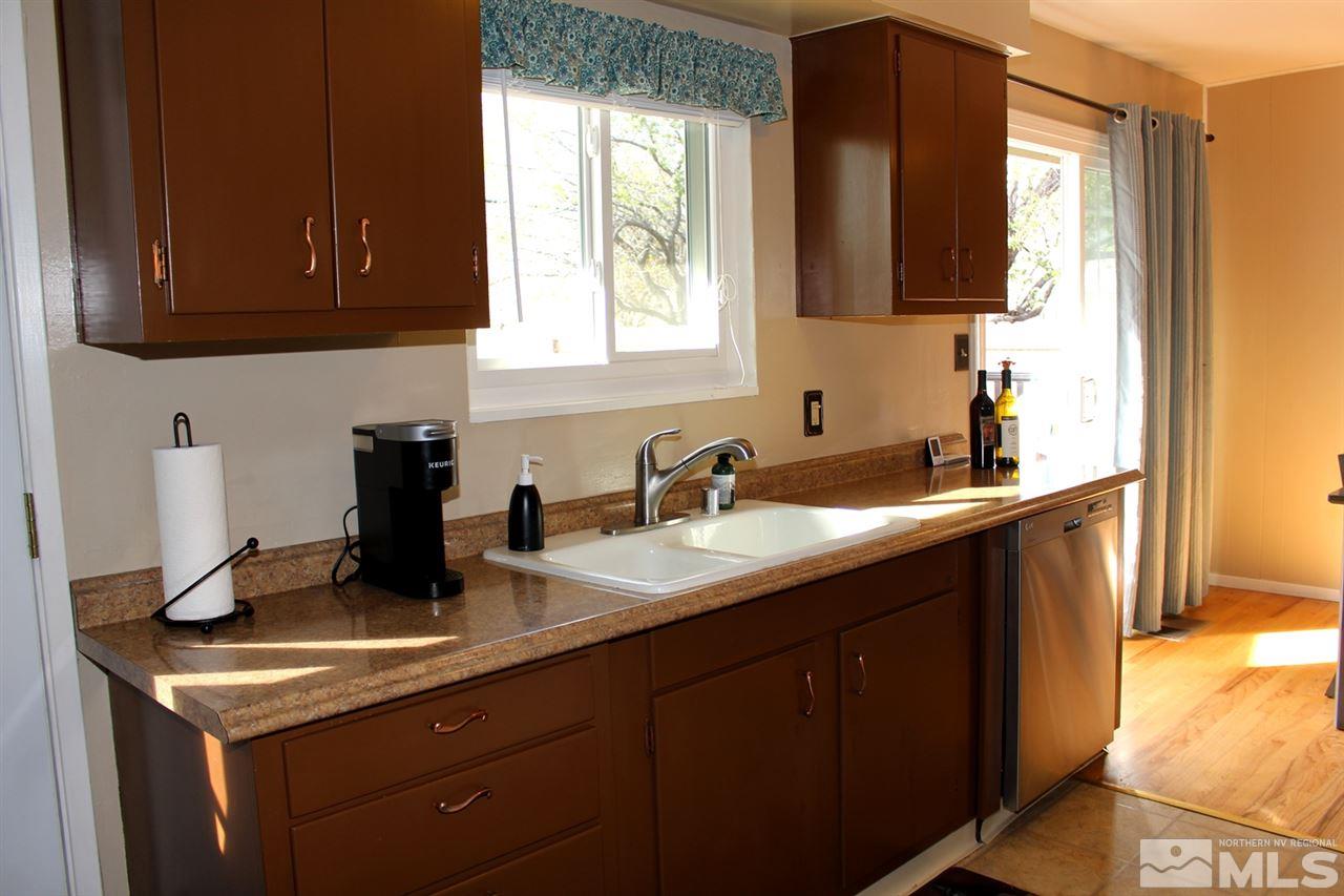 1421 Samuel Way Reno, NV 89509 - Photo 11 of 25 a kitchen with a sink and cabinets