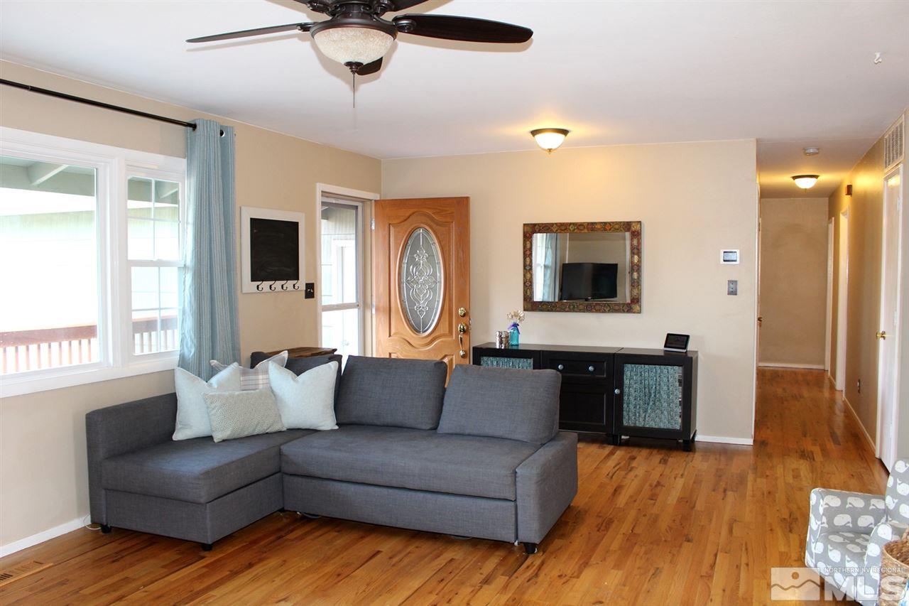 1421 Samuel Way Reno, NV 89509 - Photo 8 of 25 a living room with furniture and a flat screen tv