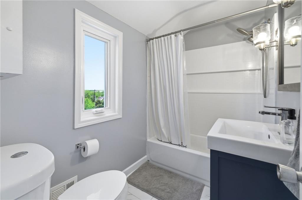 4883 East Willock Road Pittsburgh, PA 15227 - Photo 23 of 33 a bathroom with a sink a toilet and shower