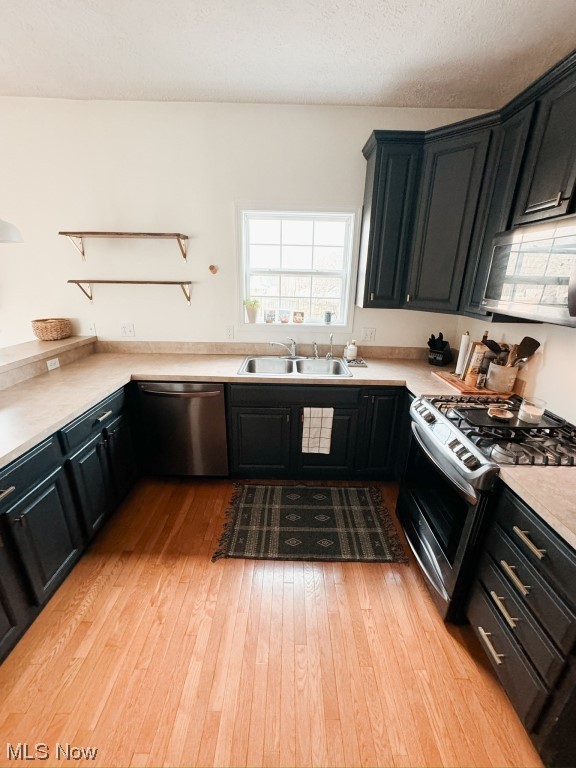3249 Rausch Avenue Ravenna, OH 44266 - Photo 10 of 35 Kitchen with light hardwood / wood-style flooring, appliances with stainless steel finishes, and sink