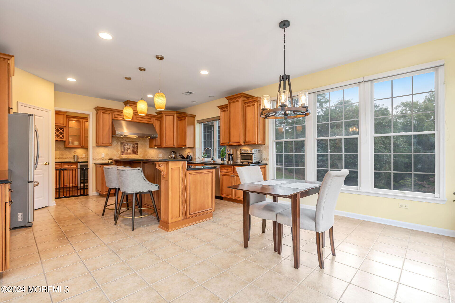 20 Crape Myrtle Drive Holmdel, NJ 07733 - Photo 10 of 53 a dining table chairs and a view of kitchen