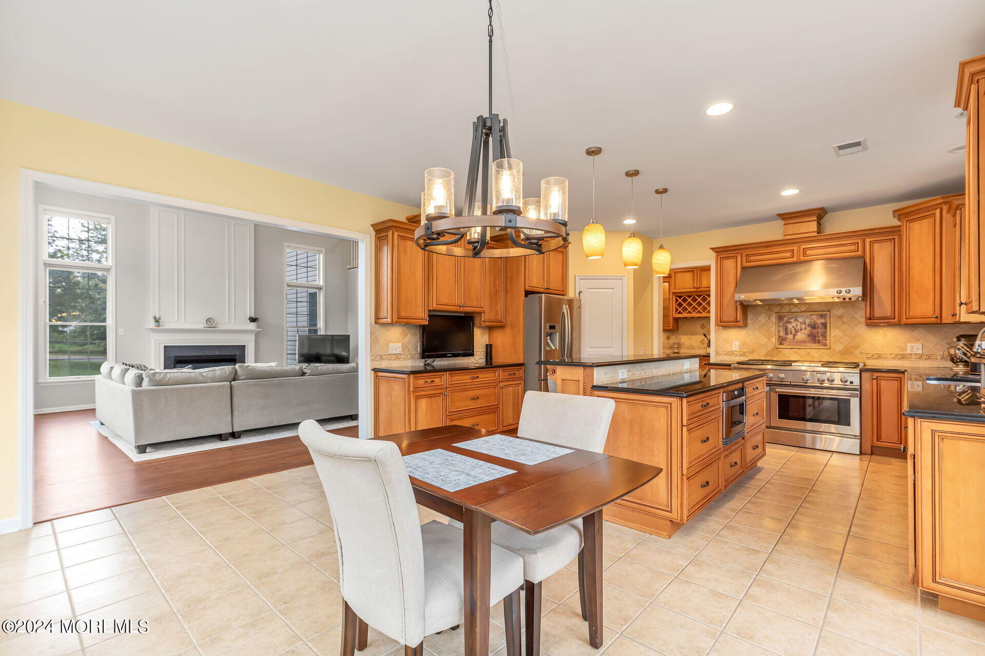 20 Crape Myrtle Drive Holmdel, NJ 07733 - Photo 11 of 53 a large kitchen with a table and chairs