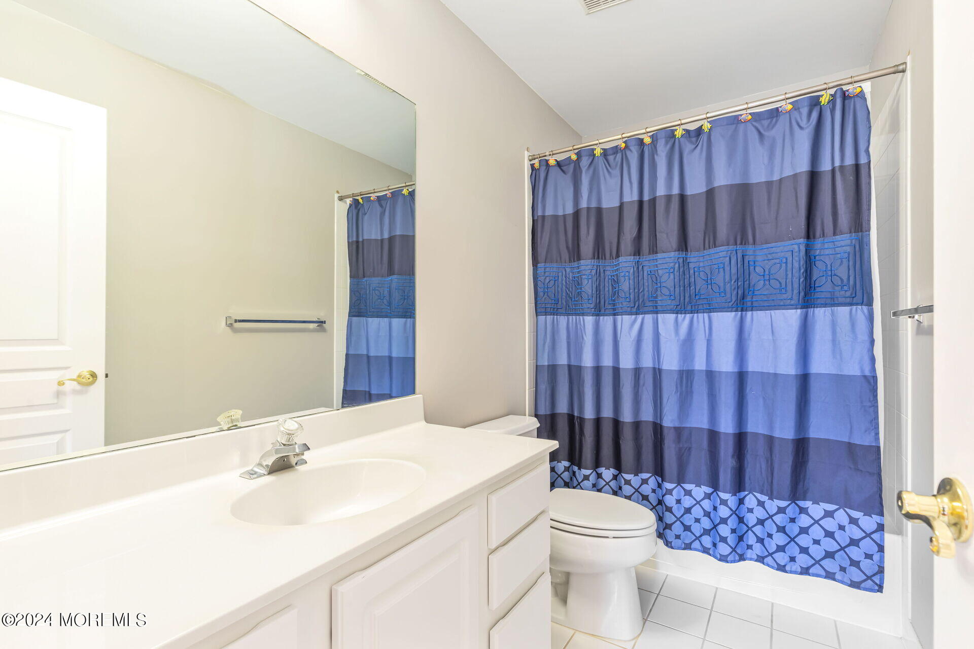 20 Crape Myrtle Drive Holmdel, NJ 07733 - Photo 30 of 53 a bathroom with a sink a toilet and shower curtain