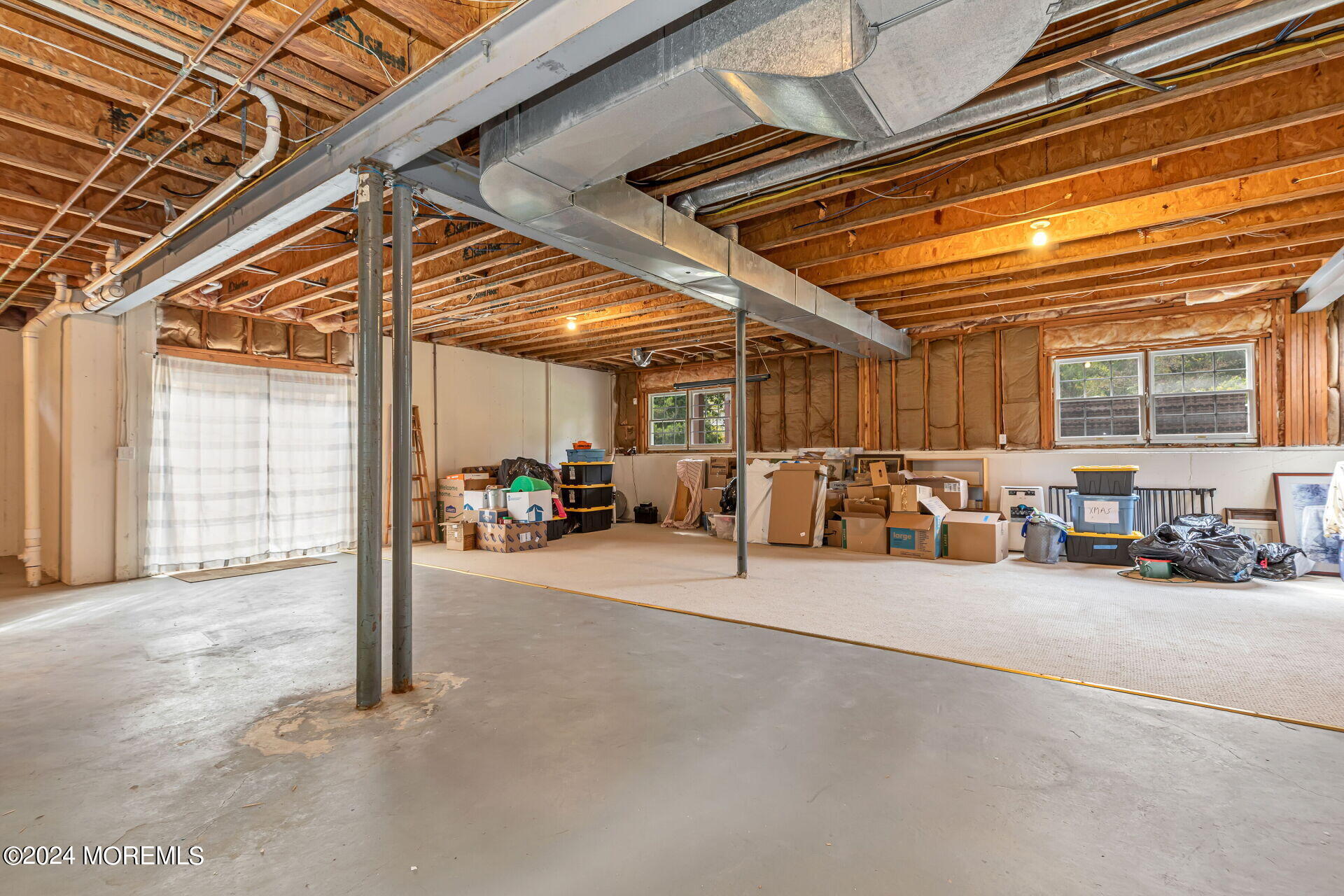 20 Crape Myrtle Drive Holmdel, NJ 07733 - Photo 35 of 53 a view of a garage with furniture