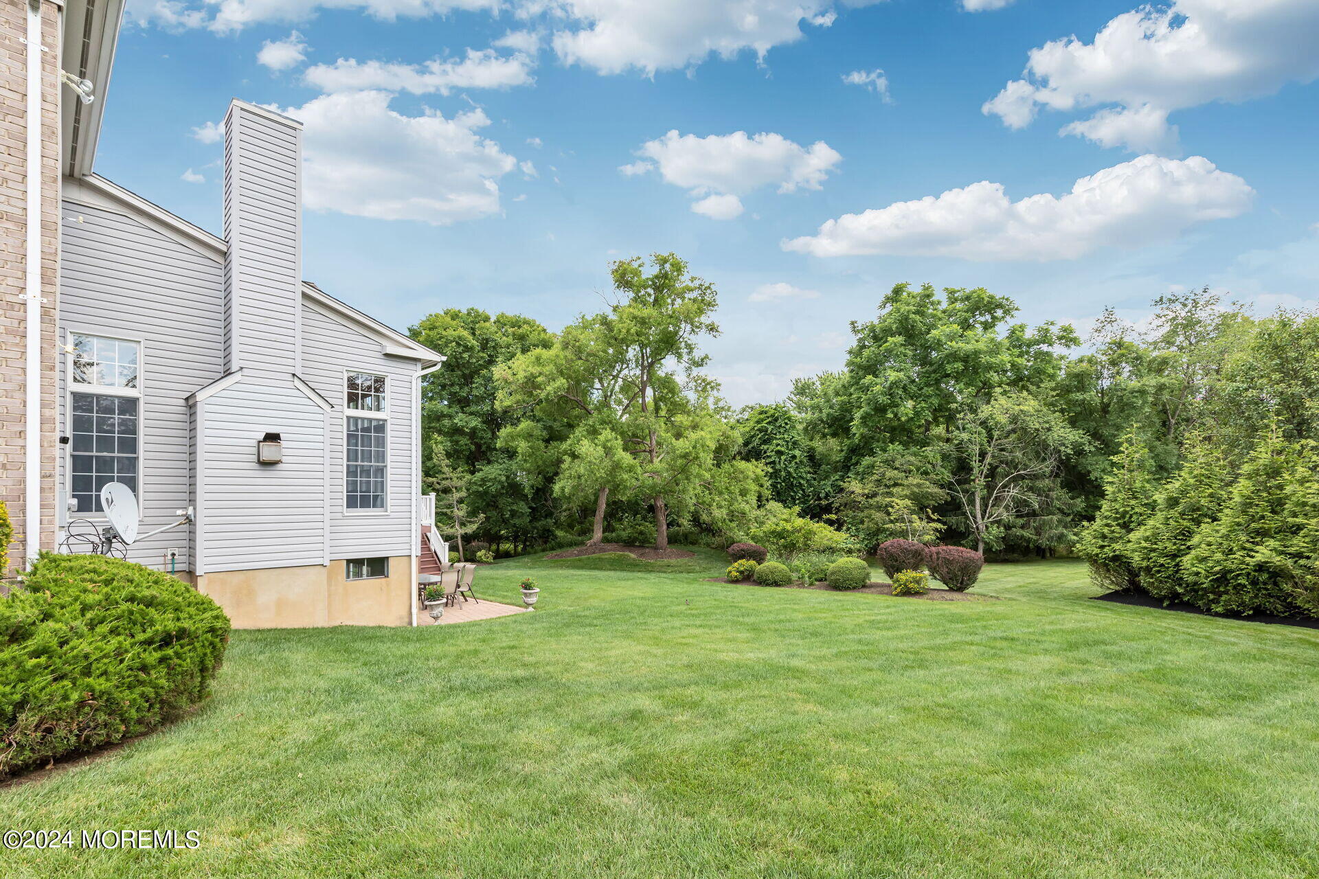 20 Crape Myrtle Drive Holmdel, NJ 07733 - Photo 40 of 53 a view of a garden with a fountain