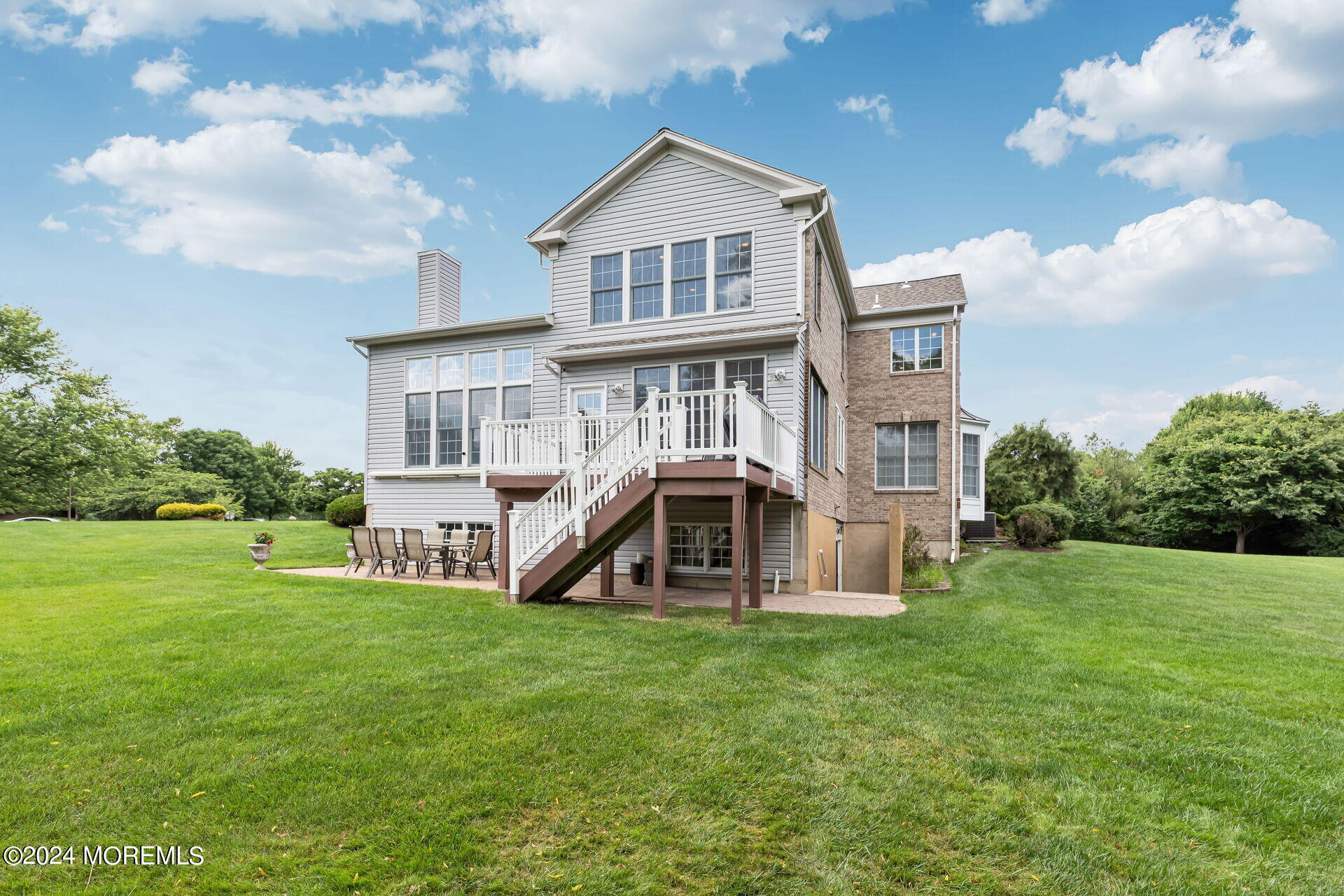 20 Crape Myrtle Drive Holmdel, NJ 07733 - Photo 43 of 53 a view of a house with a big yard and large trees