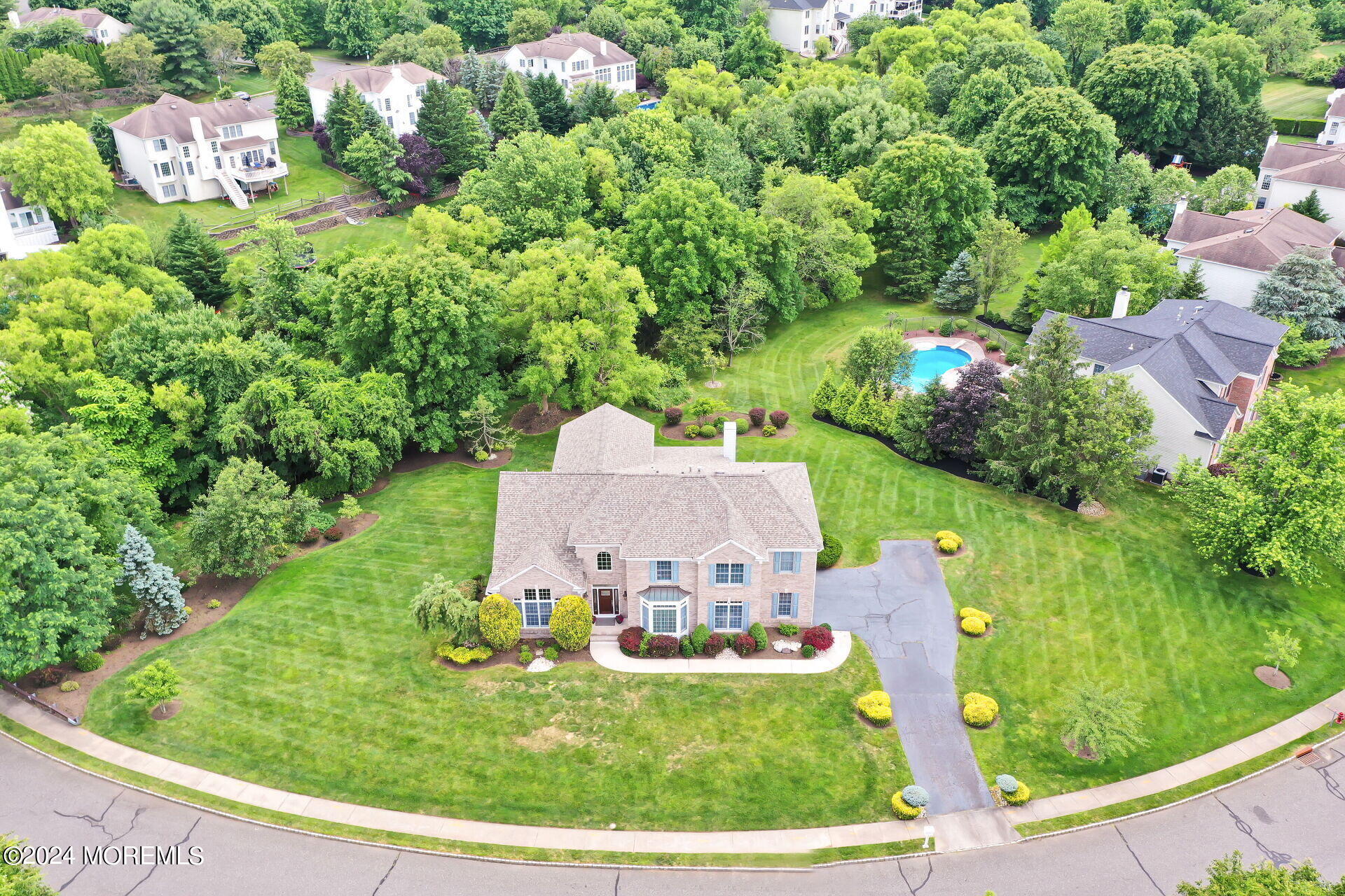20 Crape Myrtle Drive Holmdel, NJ 07733 - Photo 45 of 53 a view of a garden with a fountain