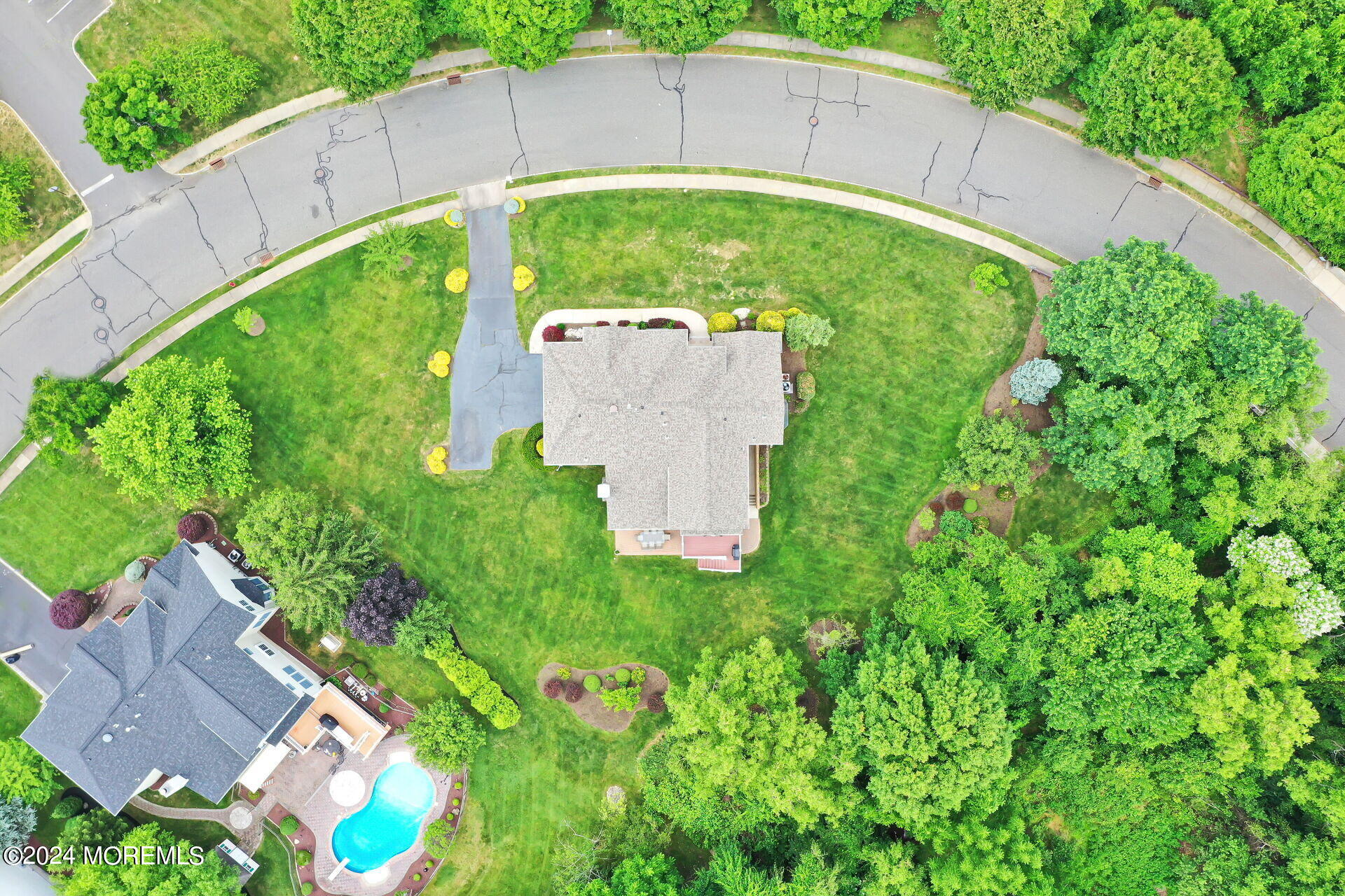 20 Crape Myrtle Drive Holmdel, NJ 07733 - Photo 47 of 53 a backyard of a house with a garden and plants