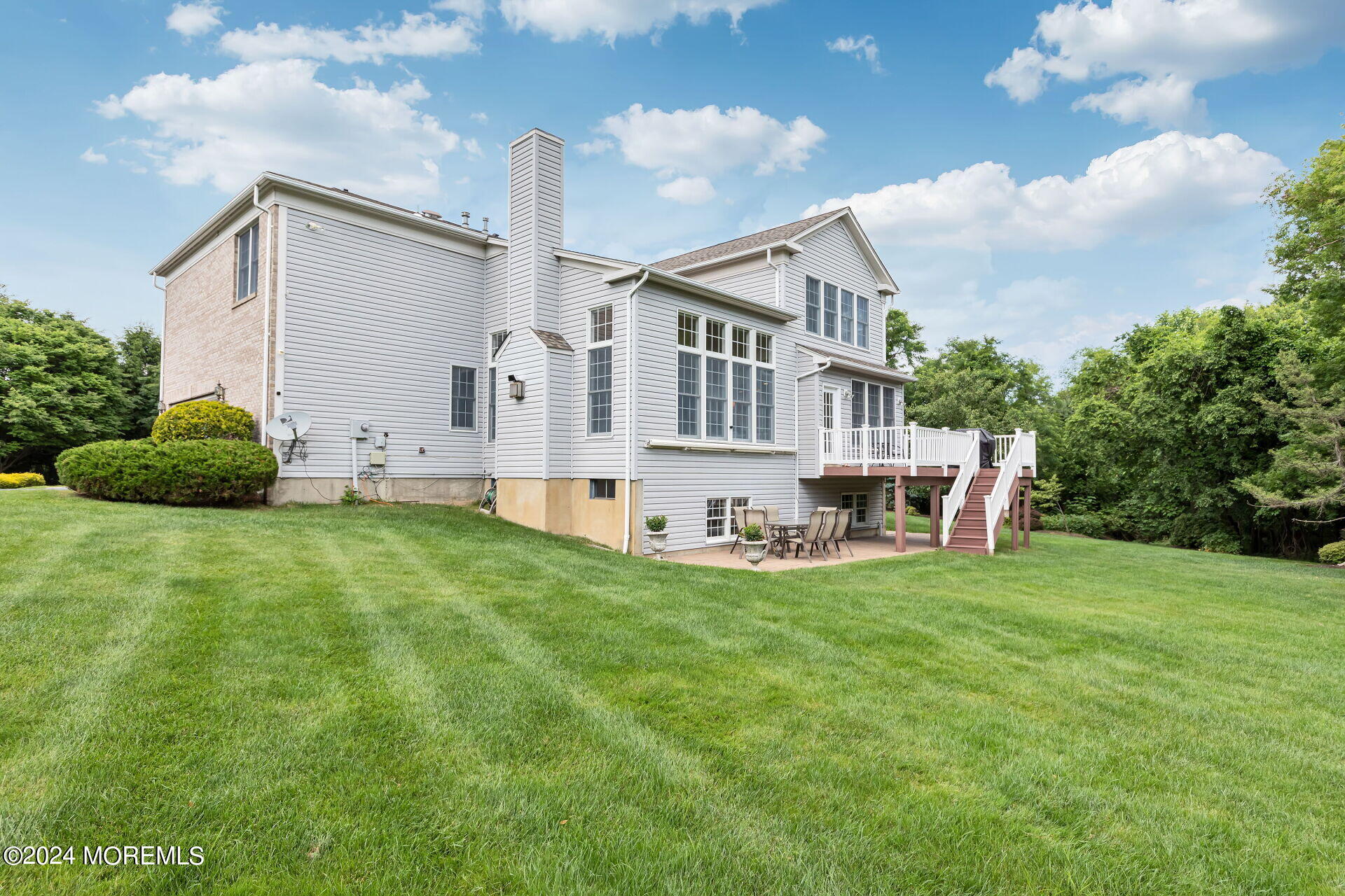 20 Crape Myrtle Drive Holmdel, NJ 07733 - Photo 5 of 53 a view of a house with a yard and sitting area