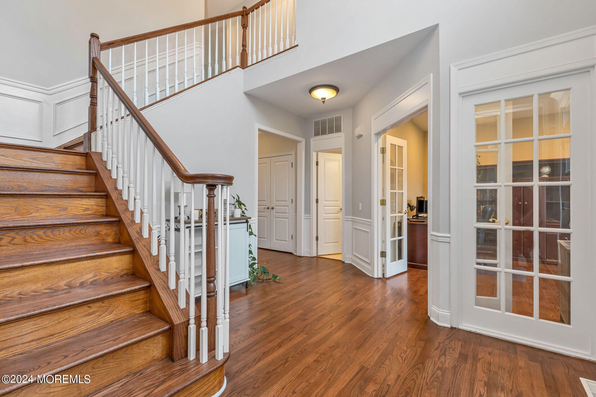 20 Crape Myrtle Drive Holmdel, NJ 07733 - Photo 7 of 53 a view of an entryway with wooden floor and door