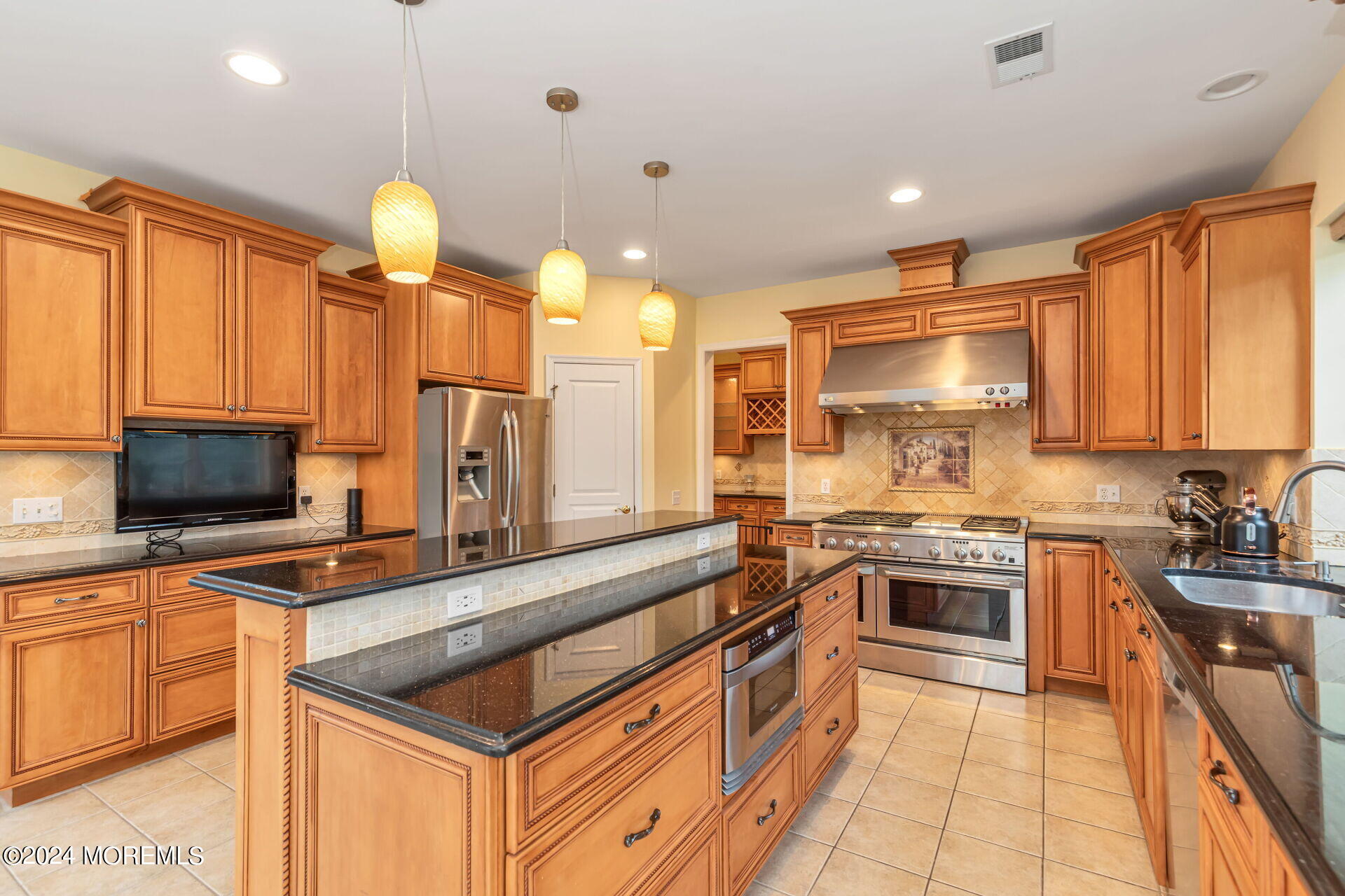 20 Crape Myrtle Drive Holmdel, NJ 07733 - Photo 9 of 53 a kitchen with stainless steel appliances a stove sink microwave and cabinets