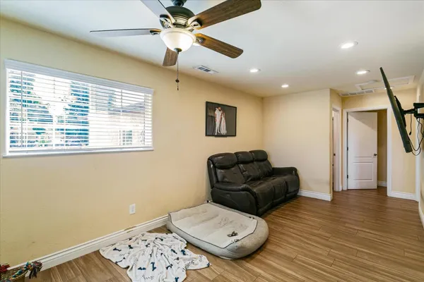 a living room with furniture and a window