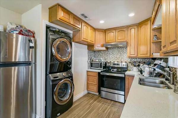 a view of a kitchen with washer and dryer
