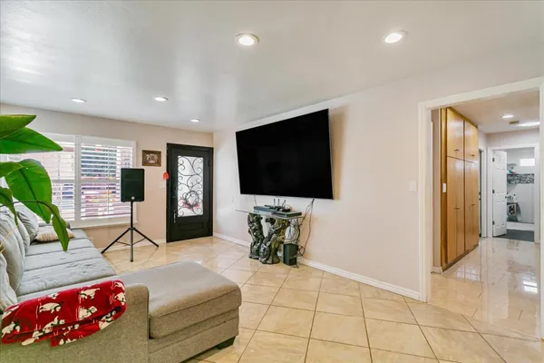 a living room with furniture and a flat screen tv