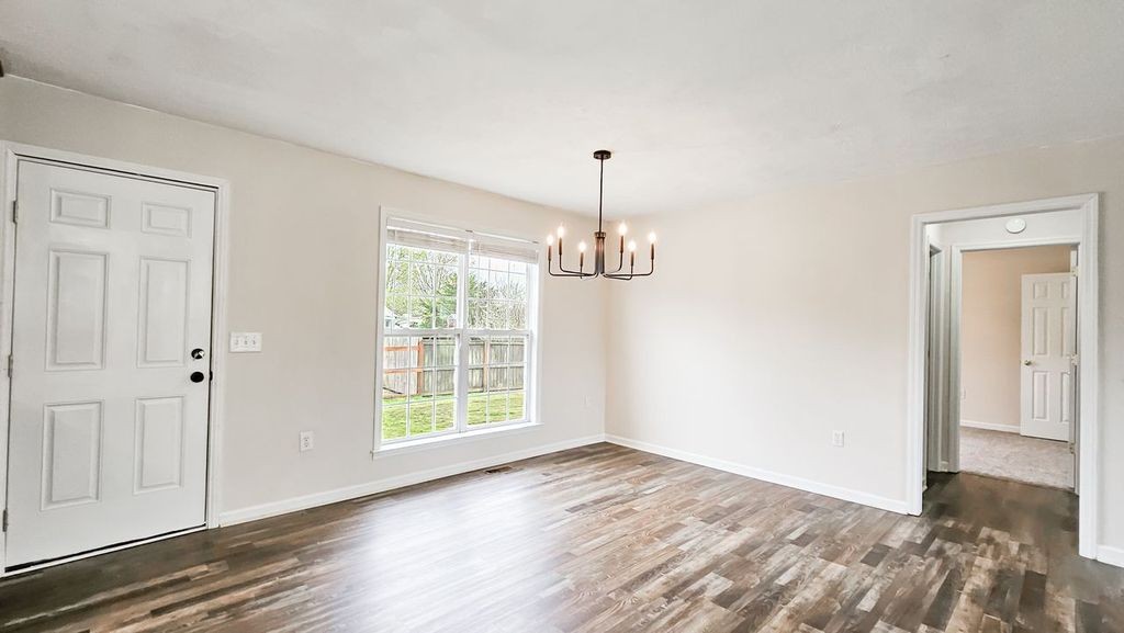 11 Amberwood Road Fayetteville, TN 37334 - Photo 12 of 36 a view of empty room with wooden floor and fan