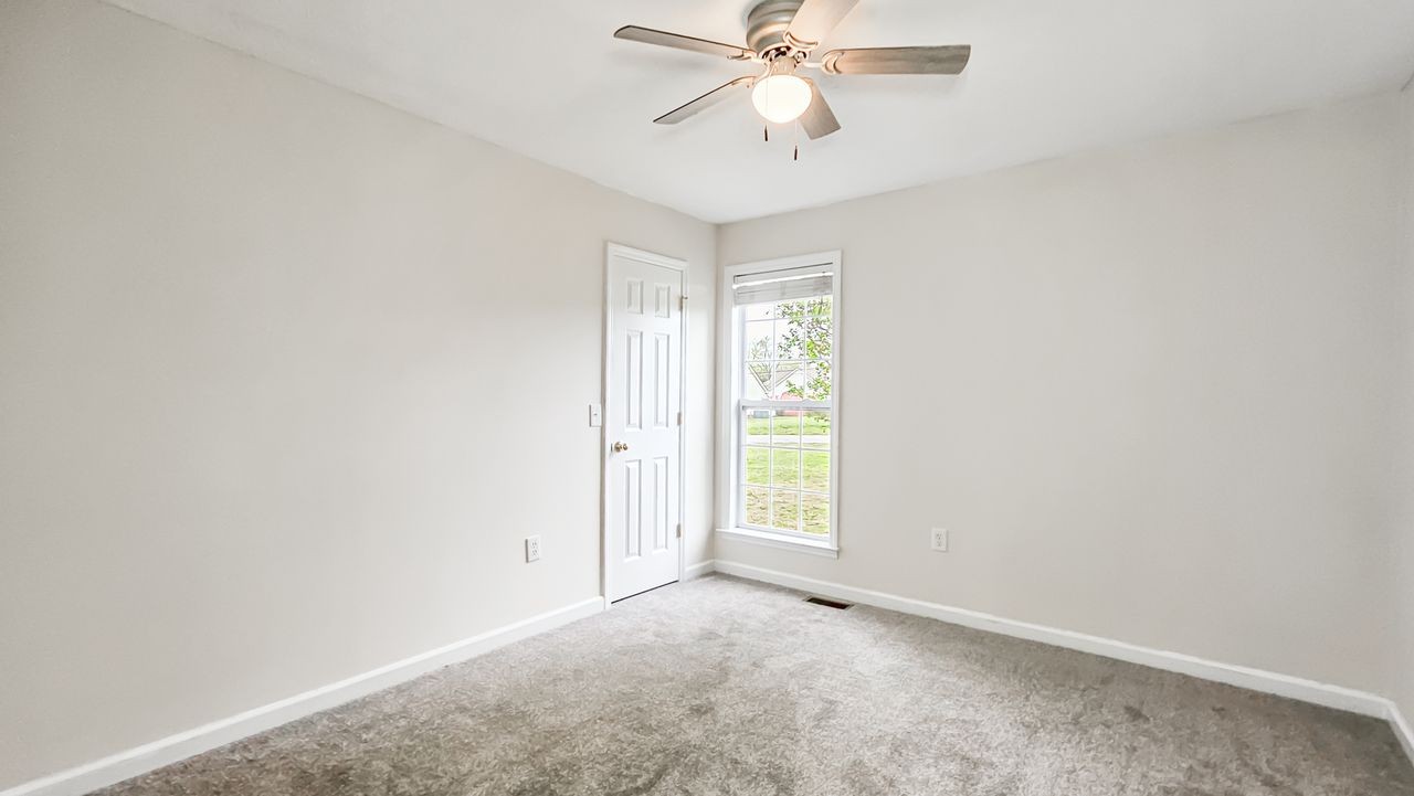 11 Amberwood Road Fayetteville, TN 37334 - Photo 14 of 36 an empty room with closet and a chandelier fan